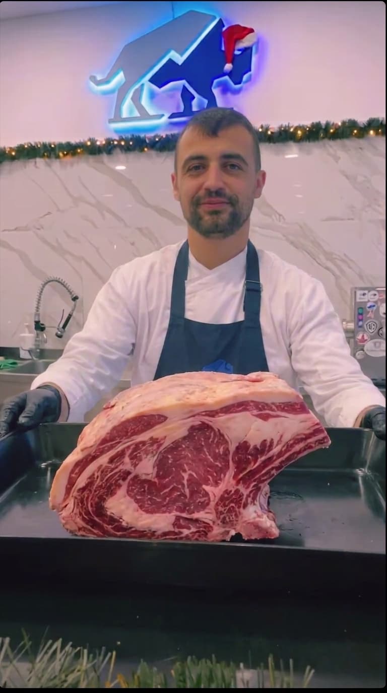 The Vous butcher cutting fresh meat